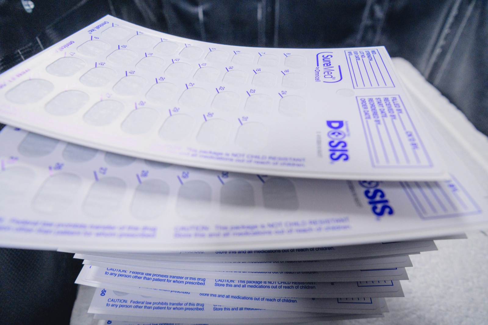DOSIS-branded blister cards